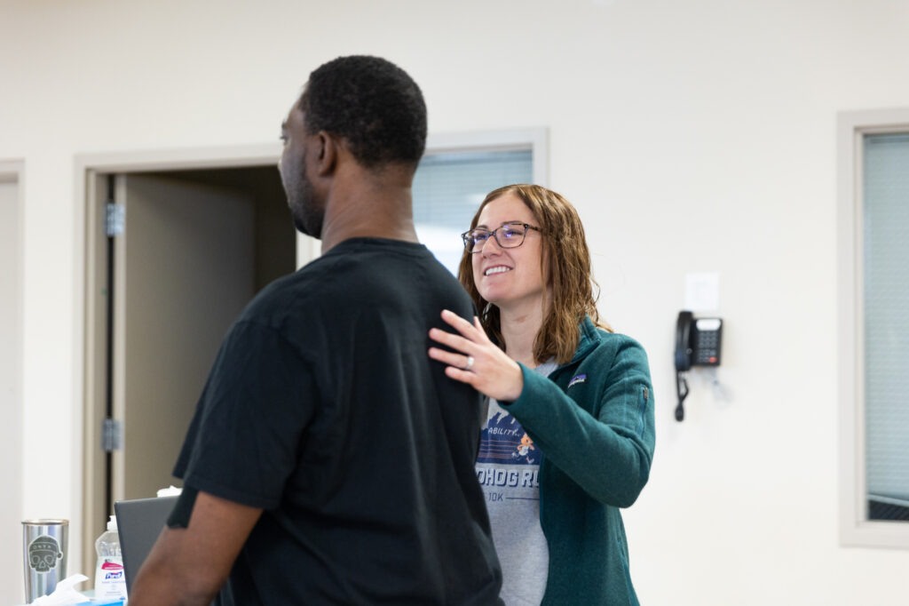 Therapist Alison smiling at adult med rehab patient